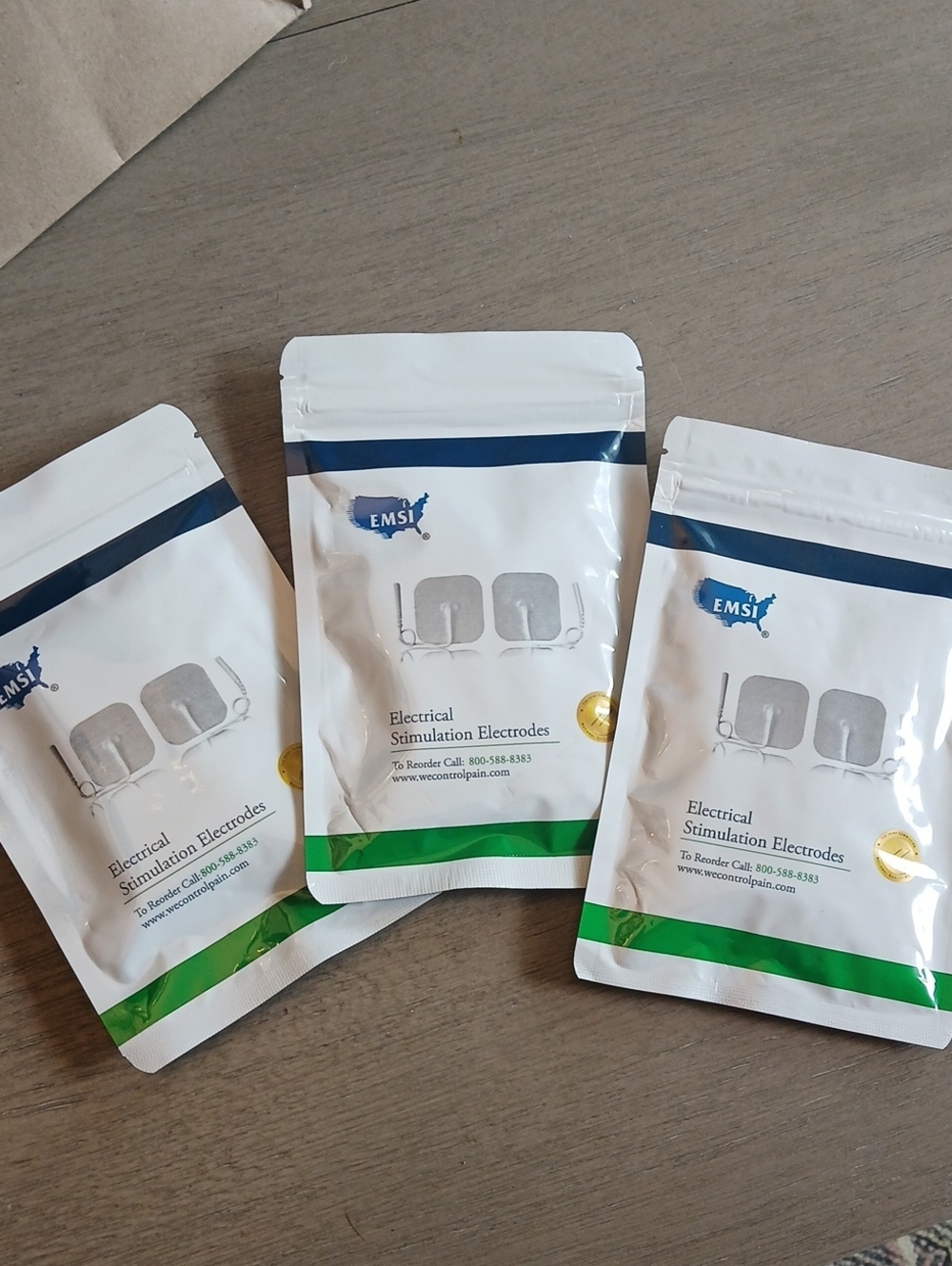 EMSI White and Blue TENS/EMS Electrode Pad Pack with Green Accent